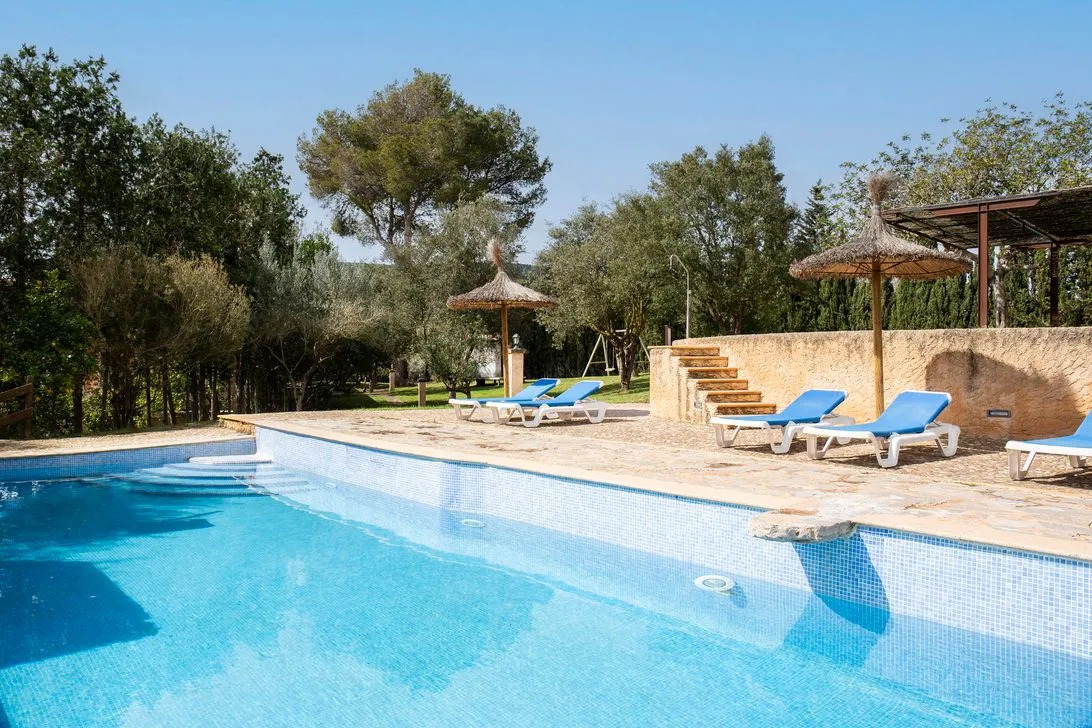 The pool with its loungers and straw parasols