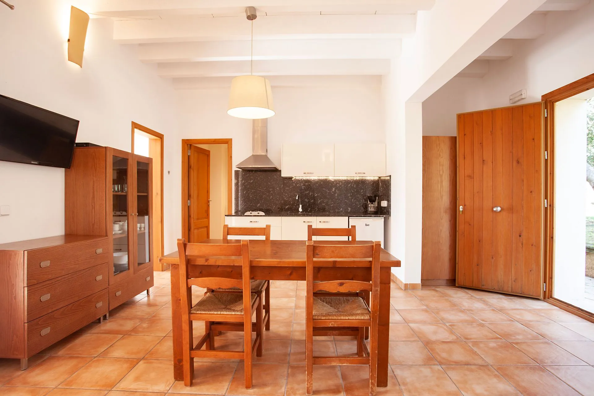 An open sitting room and kitchen
